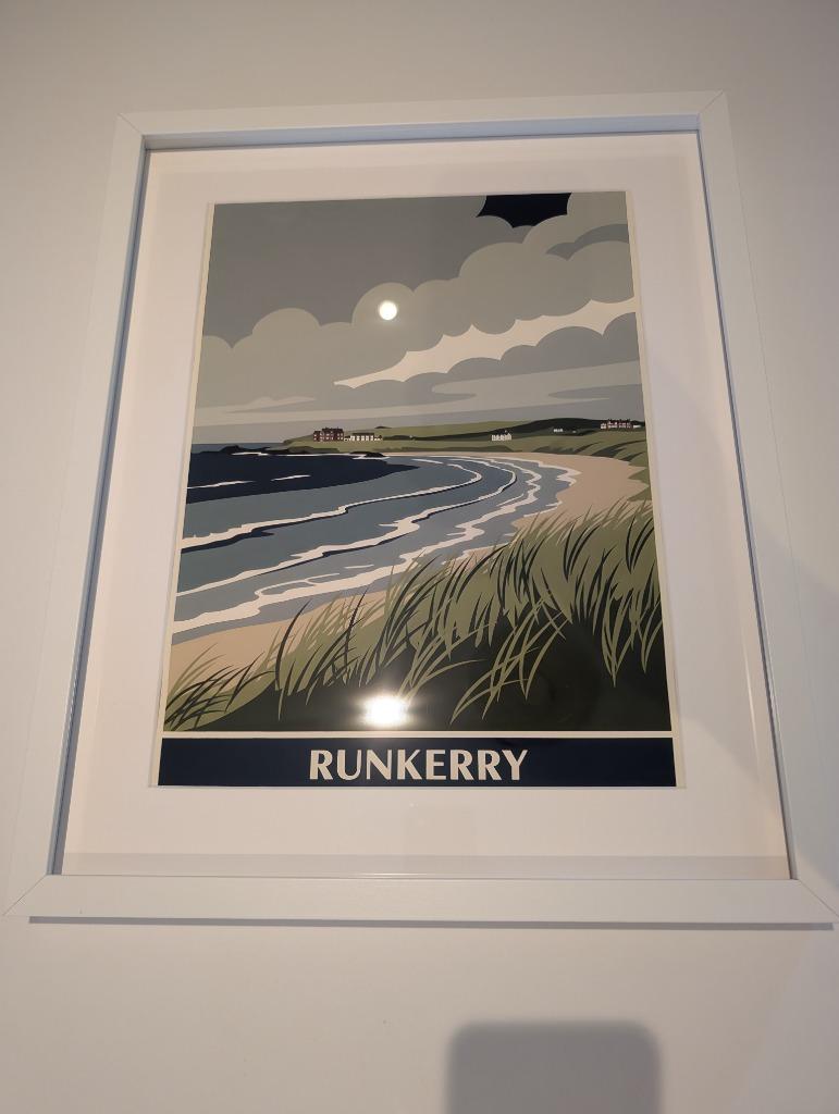 A RetroRoam print of Runkerry in a white frame, hung on a wall